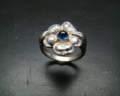 Beautiful Sterling Silver flower ring with genuine diamonds and cabachon sapphire