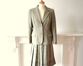 Vintage 1970s classic skirt suit in grey green wool tweed with single breasted blazer and pleated knee length check skirt medium