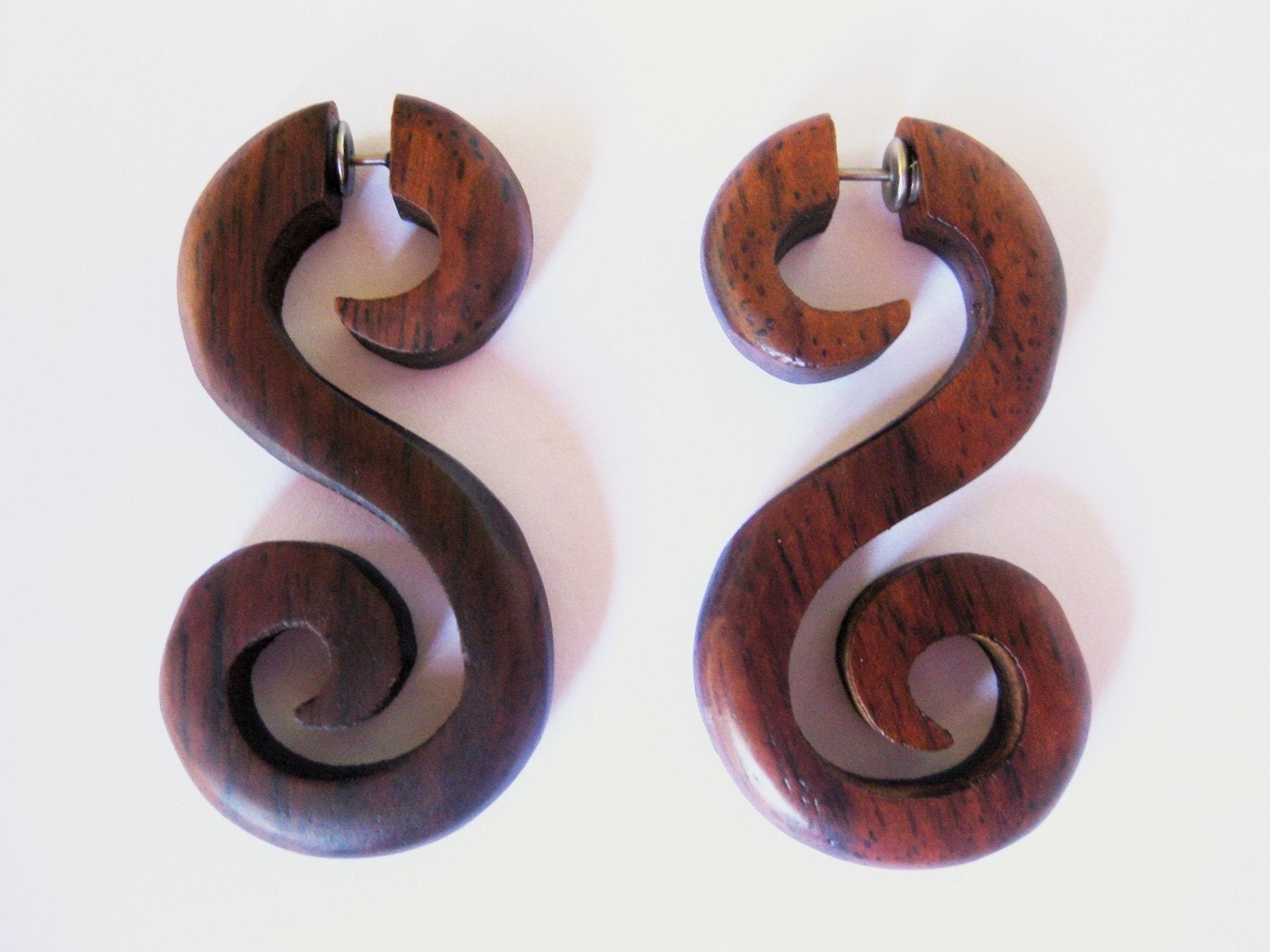 Beautiful spiral brown wooden fake gauges