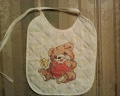 finished cross stitch bib