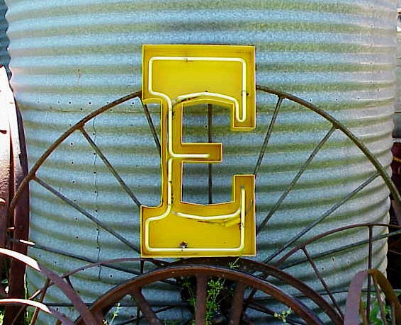 vintage yellow metal salvaged neon sign letter E