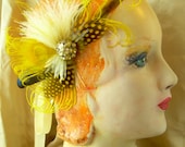 golden and mustard yellow feather fascinator with antique rhinestone button and bird friendly feathers