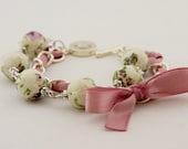 Cream floral beads and orchid ribbon bracelet