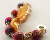 Yellow satin ribbon and red fabric beads bracelet