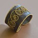 wire woven spiral and leather bracelet