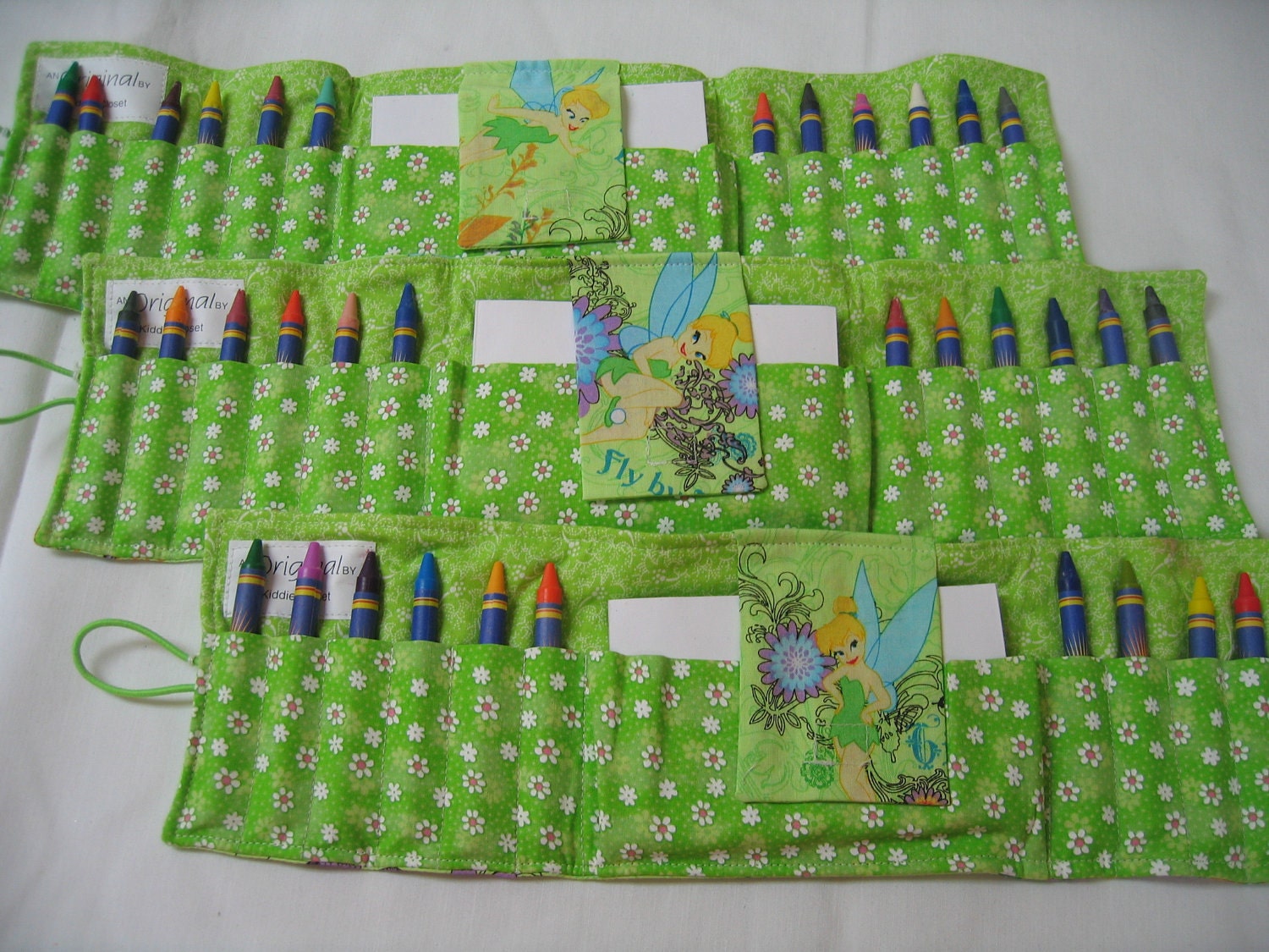 Green Tinker Bell Crayon Tote in colorful fabric complete with crayons and paper pad
