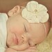Small Vintage Soft Pink Flower Headband with ivory white and gold pearl center on a skinny light pink elastic headband