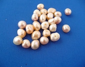 20 loose PEACH PEARLS half drilled