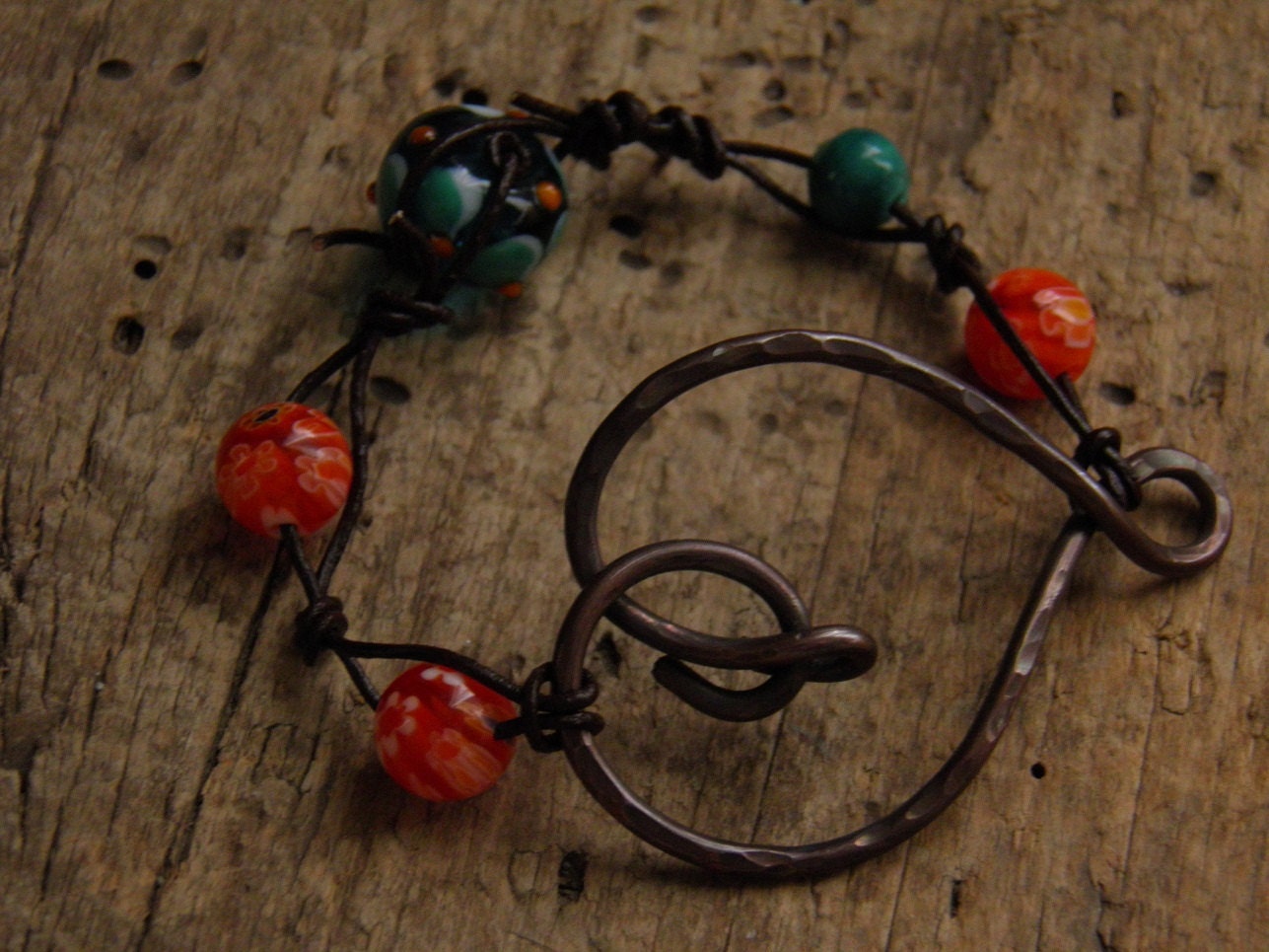 Beaded leather with copper heart bracelet.