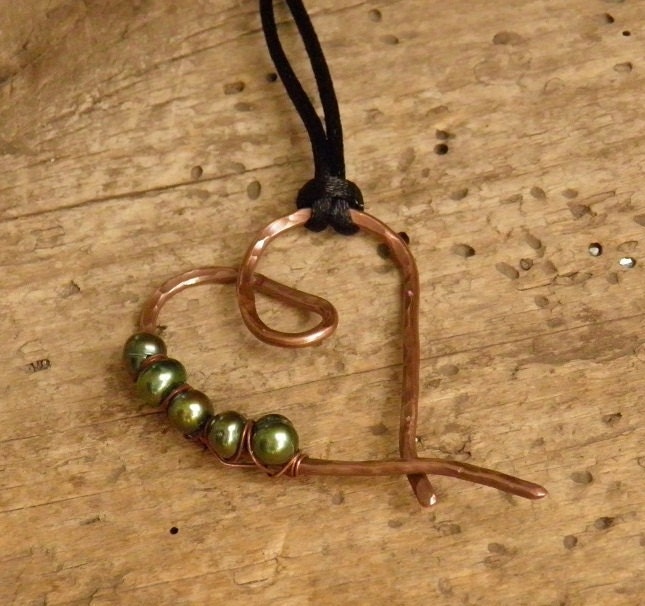 Copper heart necklace with pearls.