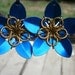 Everlasting Flower earrings in gold and blue