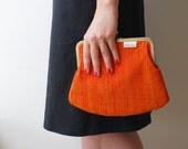 clutch purse. orange silk kiss lock purse. chain purse. snap purse