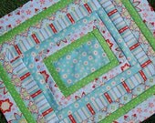 Riley Blake. DESIGNER Stroller Pram Quilt. Delighted by The Quilted Fish. QUILTED 30x34. Fleece back.