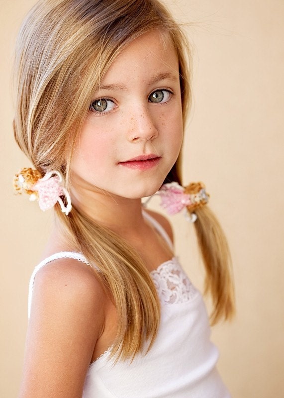 A pair of Doll hair ties