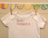 birth: nailed it --- white onesie, size 0-3 months --- pink