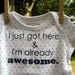 I just got here & I'm already awesome.  --- blue patterned onesie, size 0-3 months.
