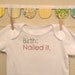 birth: nailed it --- white onesie, size 0-3 months --- pink