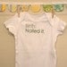 birth: nailed it --- white onesie, size 0-3 months --- green