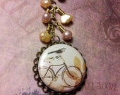 Fun and Floral Fixie - a Bicycle Necklace featuring Freshwater Pearls in Orange and Pink