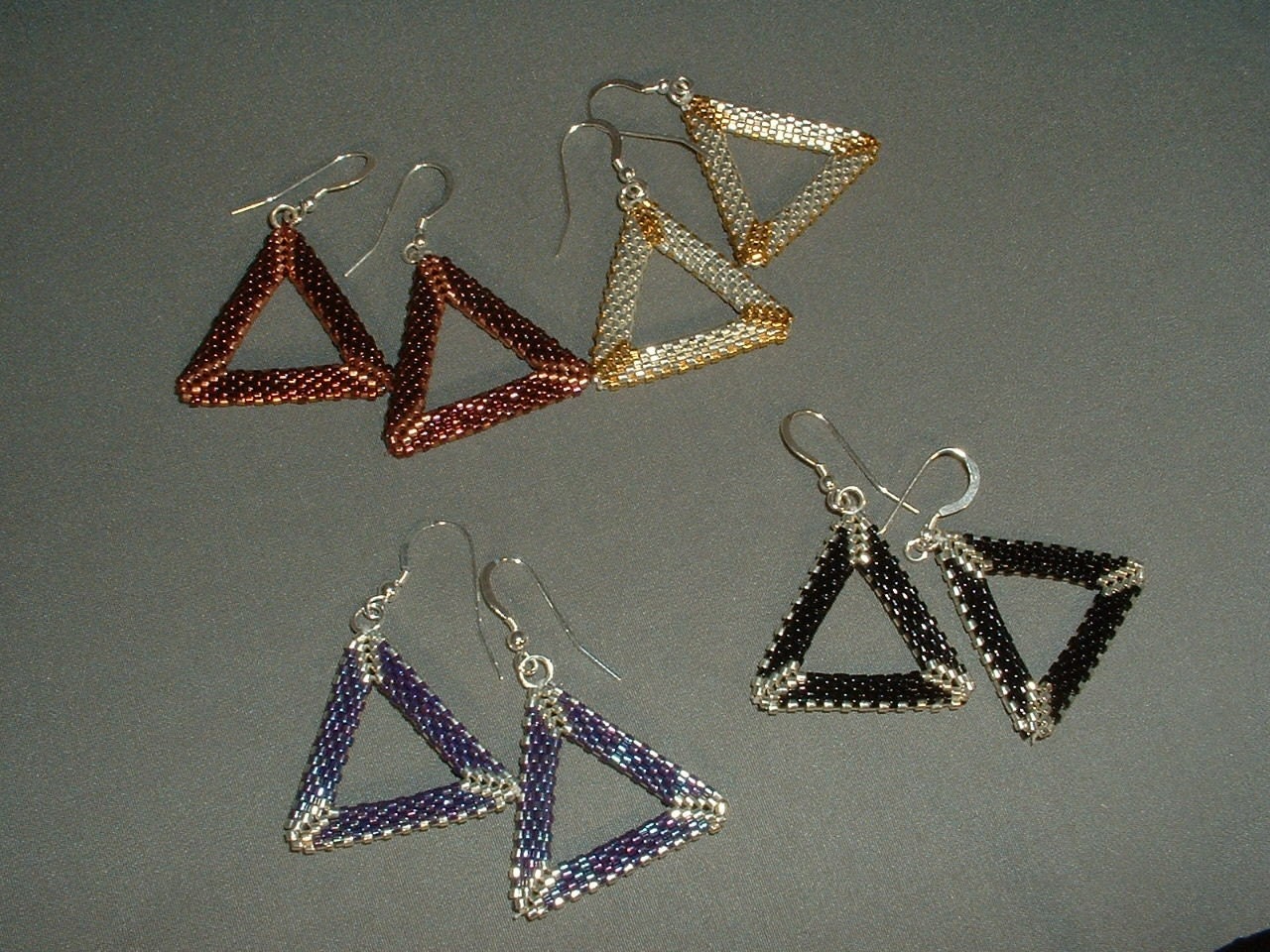 Earrings, metallic geometric beaded triangles