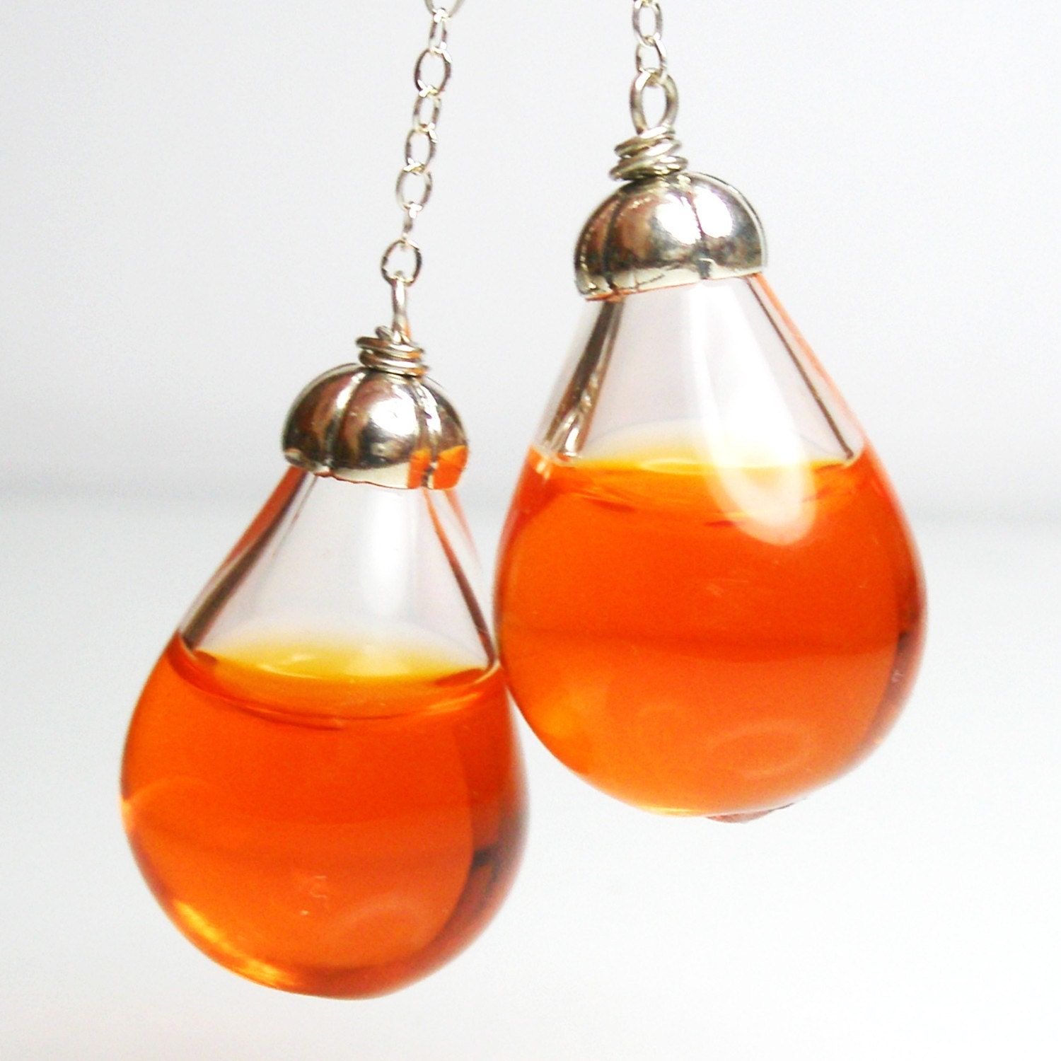 Long drop orange color water pear shaped silver plated earrings