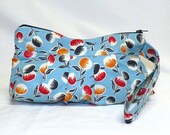 Pleated Wristlet in a vintage inspired tossed cherry print in blue, navy, red and ochre