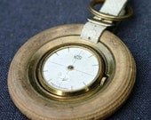 Antique watch in a tire. Great retro keyring.