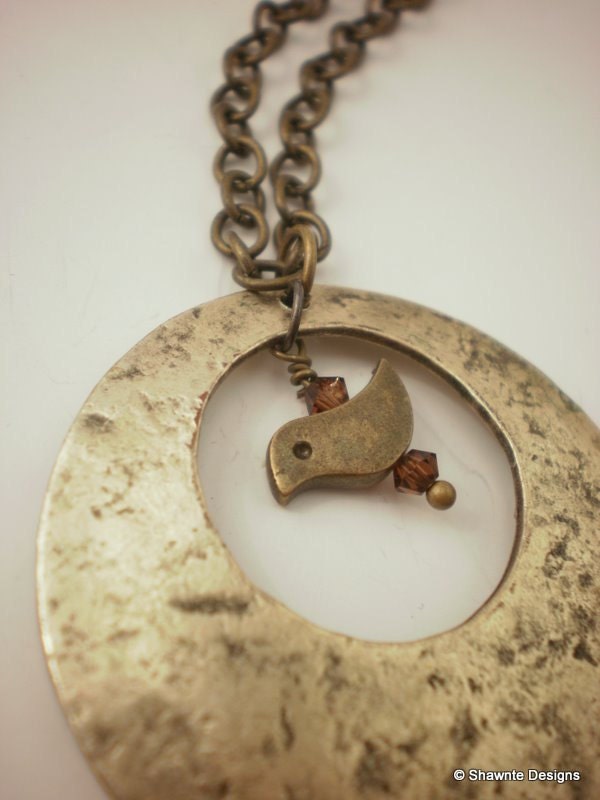 Brass bird in circle neclace