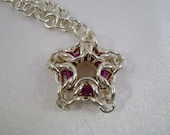 Silver Plated Star Necklace with Purple Centre