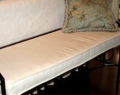 Custom made window seat or bench cushion with piping