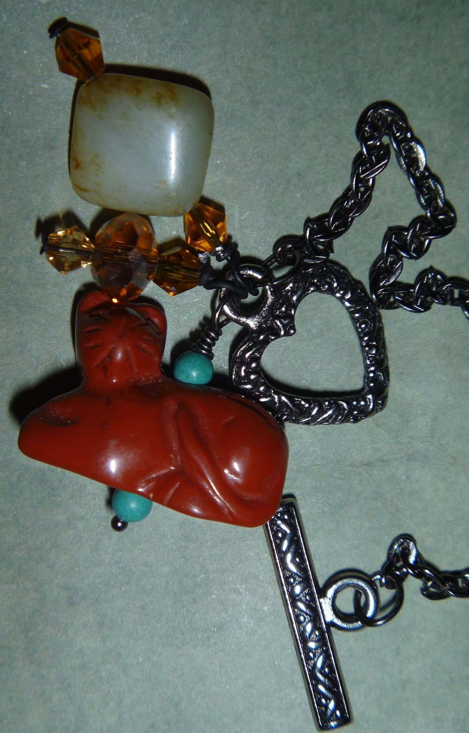 Front toggle carved red jasper cat necklace