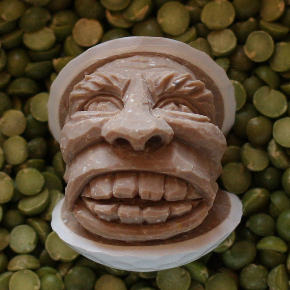 Caramel colored hand carved caricature golf ball