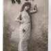 Hand Tinted European Eve figure with Pear Tree RPPC