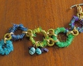 Caterpiller bracelet: blue, turquoise and green recycled sari silk ribbon circles - StudioEgallery