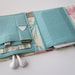 Nerd Herder gadget wallet in Feathered for iPod, Droid, iPhone, camera, earbuds, SD cards, USB, extra batteries, guitar picks,