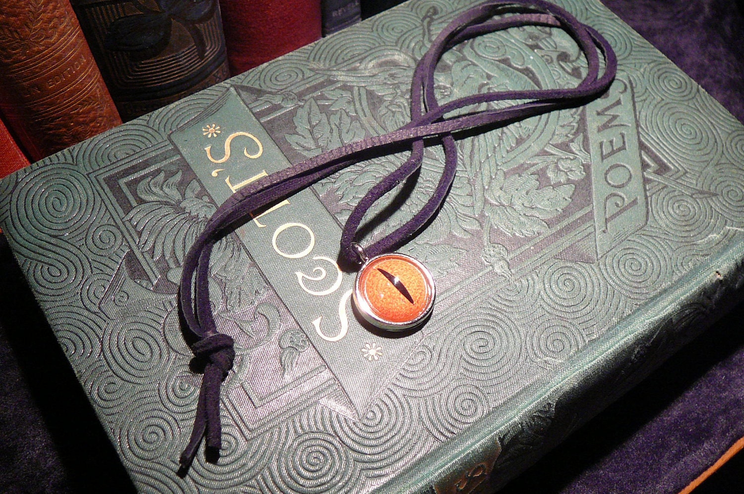 Dragon eye necklace (red-orange eye in silver bezel)
