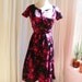 Hold for CINDY CHRISTIAN DIOR Couture 1950's vintage dress. Black Silk, Fuschia Pink Velvet Floral Print. Boned, Nipped Waist.