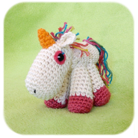 unicorn plush amigurumi crochet stuffed animal in creme, pink and rainbow cotton yarn handmade