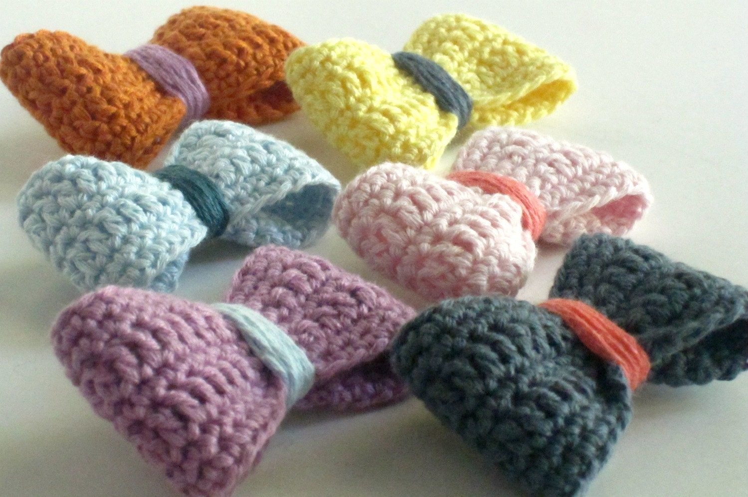 Crochet bow brooch in a rainbow of colors