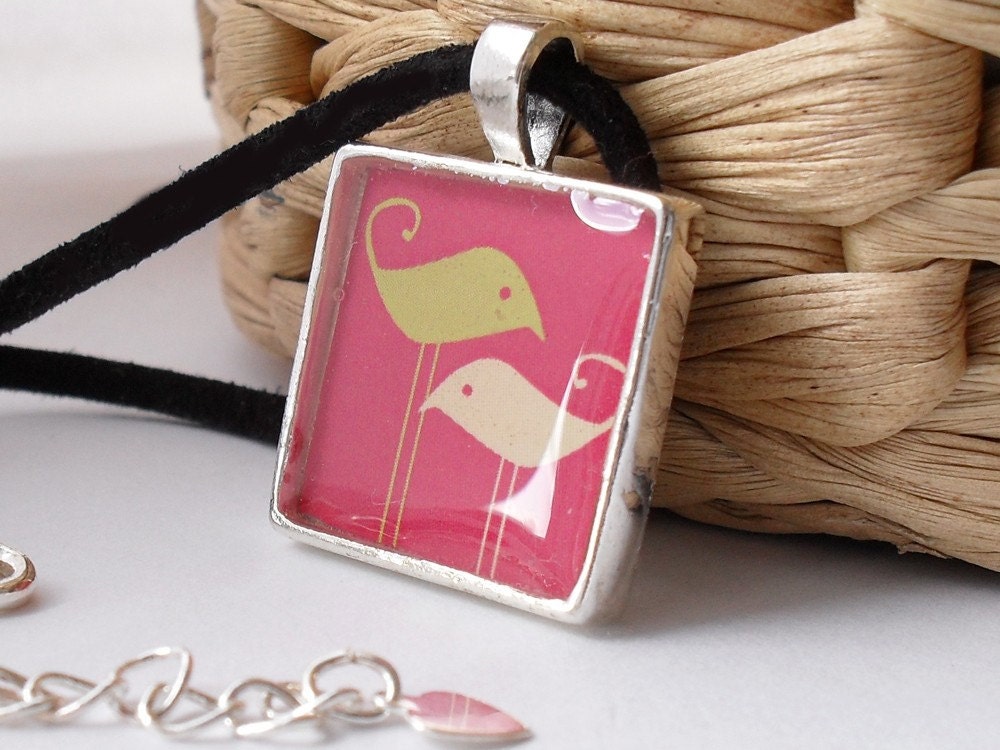 Two tall birds resin pendant