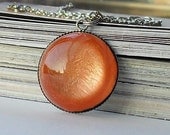 Orange shimmering resin necklace