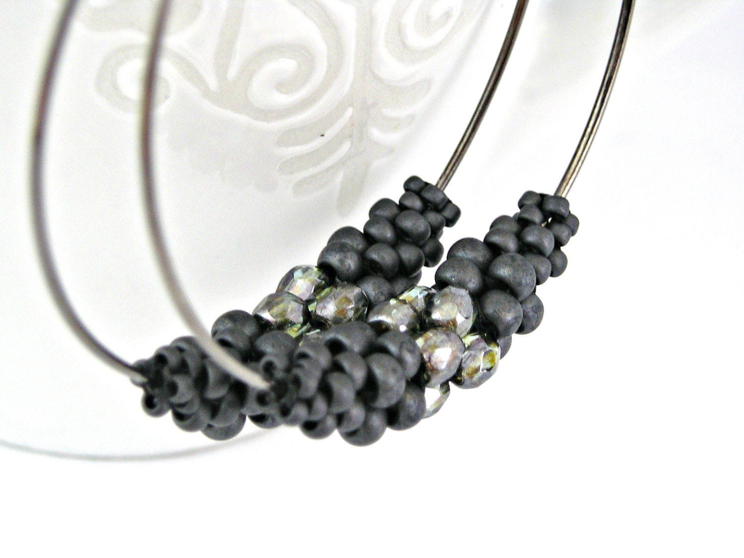 Gunmetal hoops with beaded interpiece