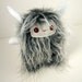 Shadow the plush horned monster shaggy white and grey stuffed animal