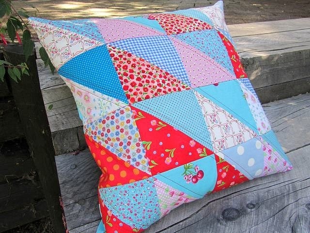 Pink, red and aqua quilted patchwork cushion cover