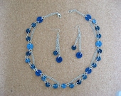 BUTTONS JEWELRY button nacklace  shade of dark blue buttons  on a silver chain. buy necklace get earring in  the same colours for  FREE