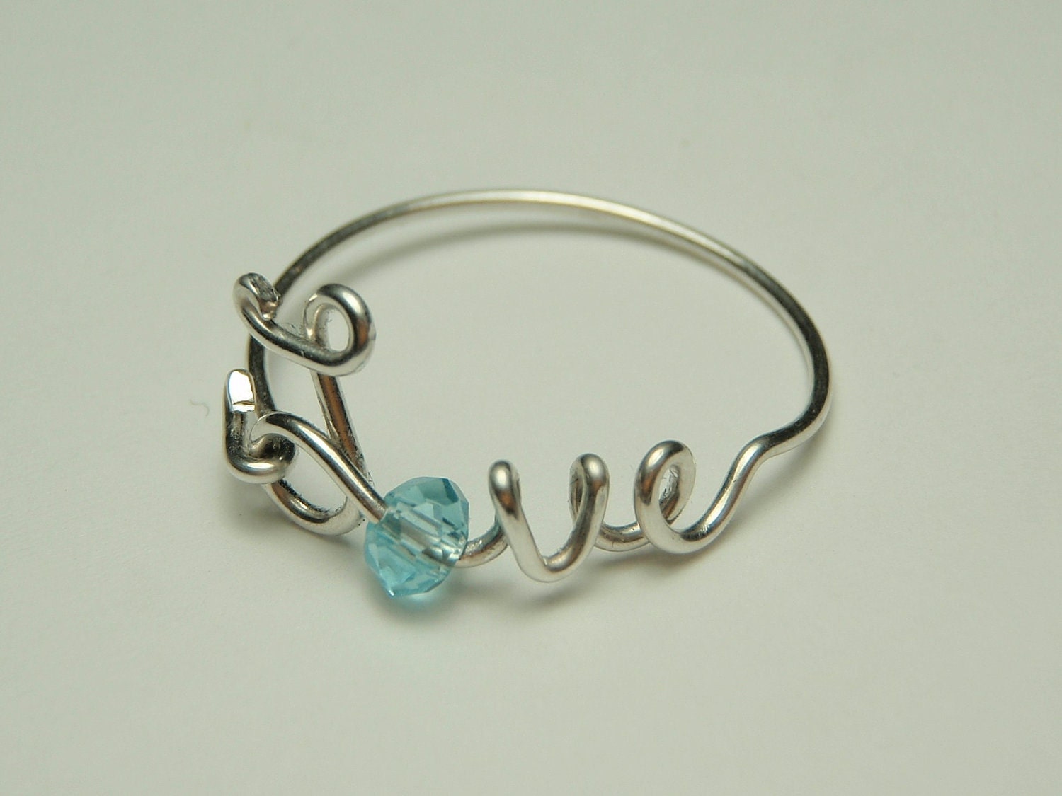 love wire ring sterling silver - baby blue faceted crystal reduced price-love word- script-italics-writing