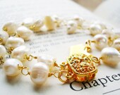 Star Crossed - 14k gold, two-strand crossing pearl bracelet