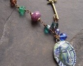 Teal Cathedral Beads, Locks and Keys, Faces and Brass Handmade Necklace