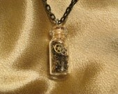 Steampunk engineer spare parts bottle / vial necklace