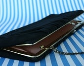 Black silk snap clutch